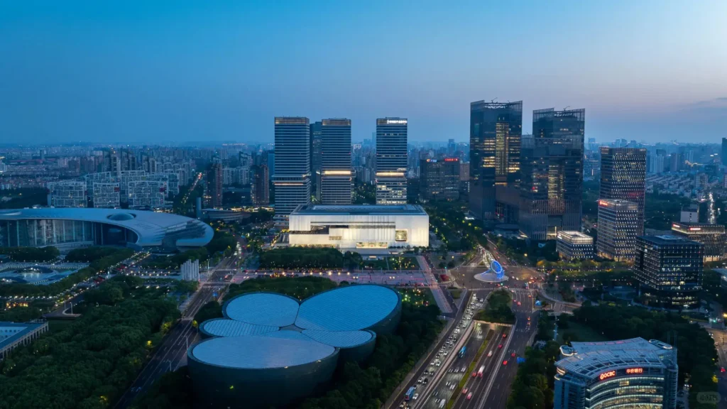 Night view of Shanghai Museum East Hall showcasing transparent structure and lighting