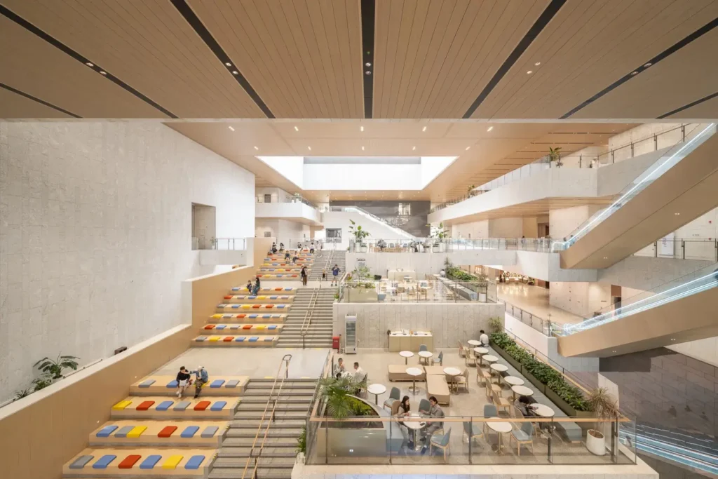 Multi-level atrium with terraced rest areas and aerial walkways inside Shanghai Museum East Hall
